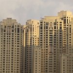 Modern residential apartment towers in Dubai at sunset