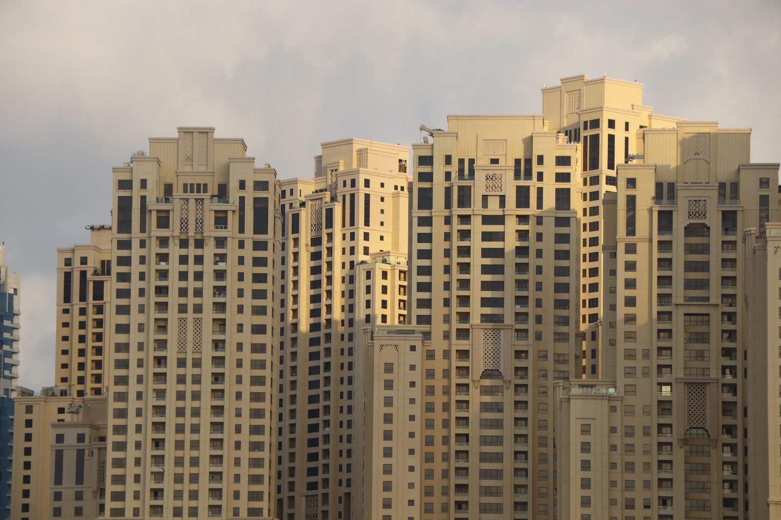 Modern residential apartment towers in Dubai at sunset