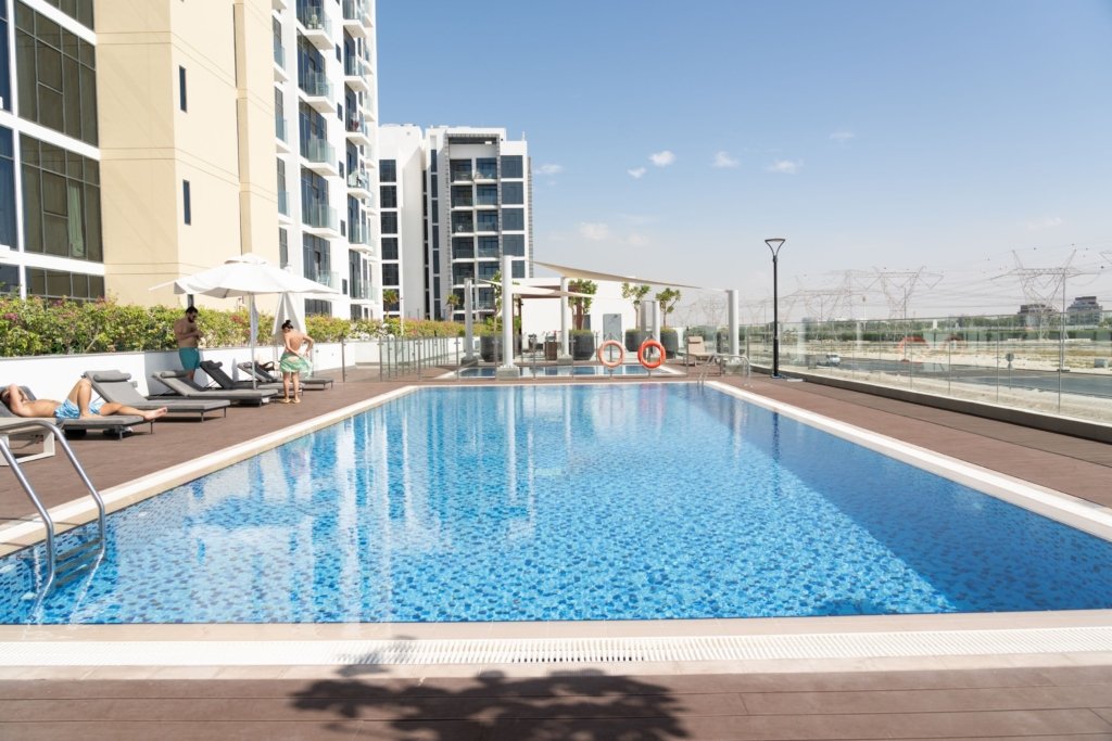 Rooftop swimming pool at a Dubai apartment building illustrating short-term rental holiday-home style amenities