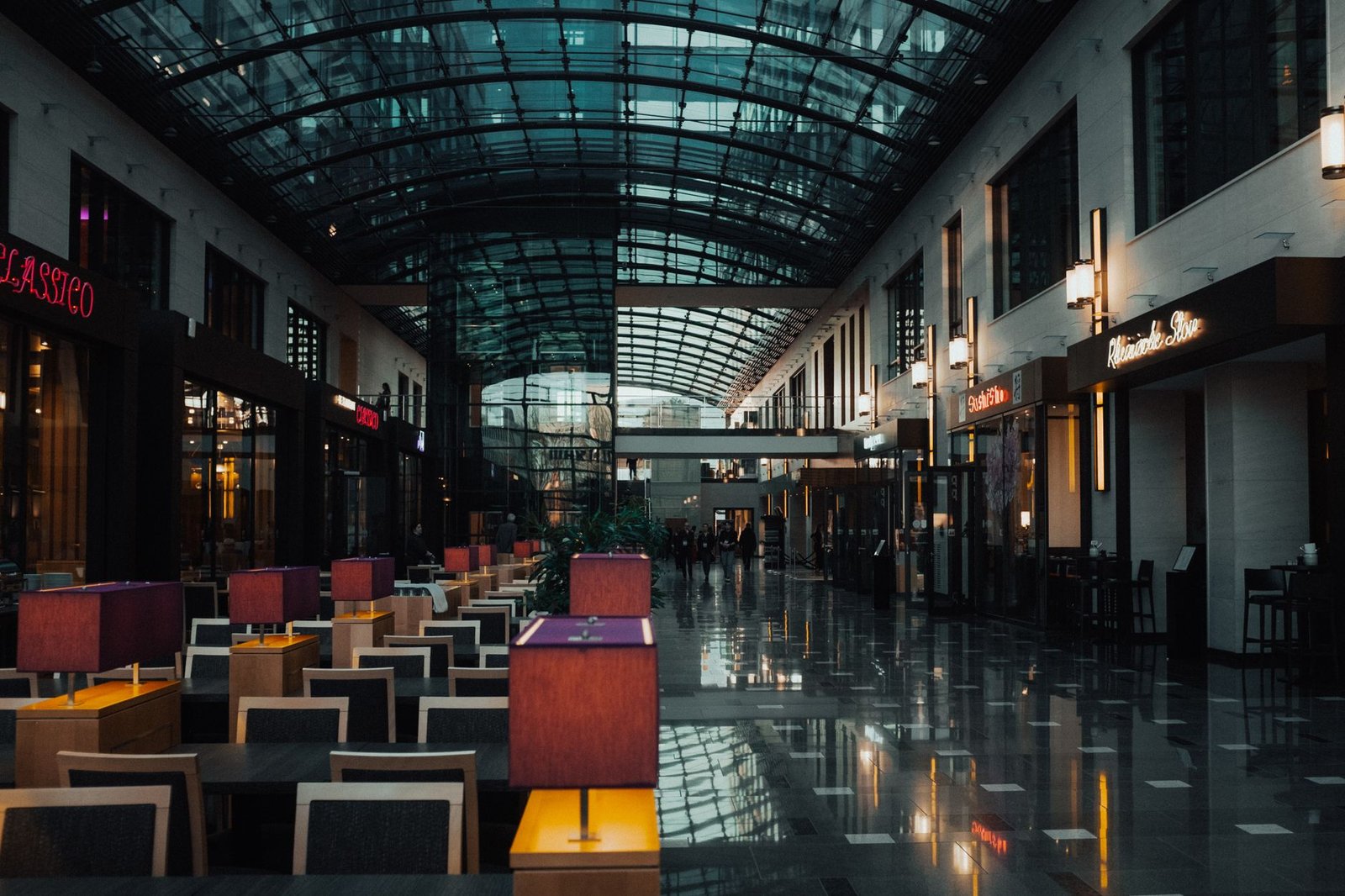 Covered shopping arcade with glass roof, restaurants and retail units, illustrating a Dubai retail property investment